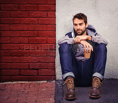Buy stock photo Fashion, wall or man on floor with coffee thinking of casual clothes, style or edgy hoodie for winter outfit. Tea, model or cool person in urban town in streetwear or trendy jacket in Italy to relax