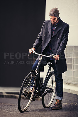 Buy stock photo Bicycle, style and man in city for travel on winter vacation, adventure or holiday with retro fashion. Vintage, stylish and male person on bike for cycling with beanie and coat for outfit in town.