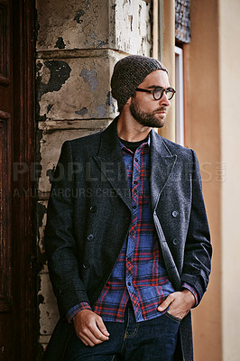 Buy stock photo Fashion, outdoor or man by a wall thinking of casual clothes, style or edgy coat for a modern winter outfit. Travel, cool model or stylish person in an urban town in beanie or trendy jacket in Italy