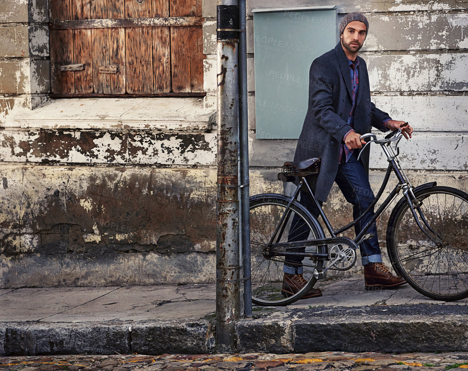 Buy stock photo Bicycle, fashion and portrait of man in city for travel on winter vacation, adventure or holiday with retro style. Vintage, stylish and male person on bike with beanie and coat for outfit in town.