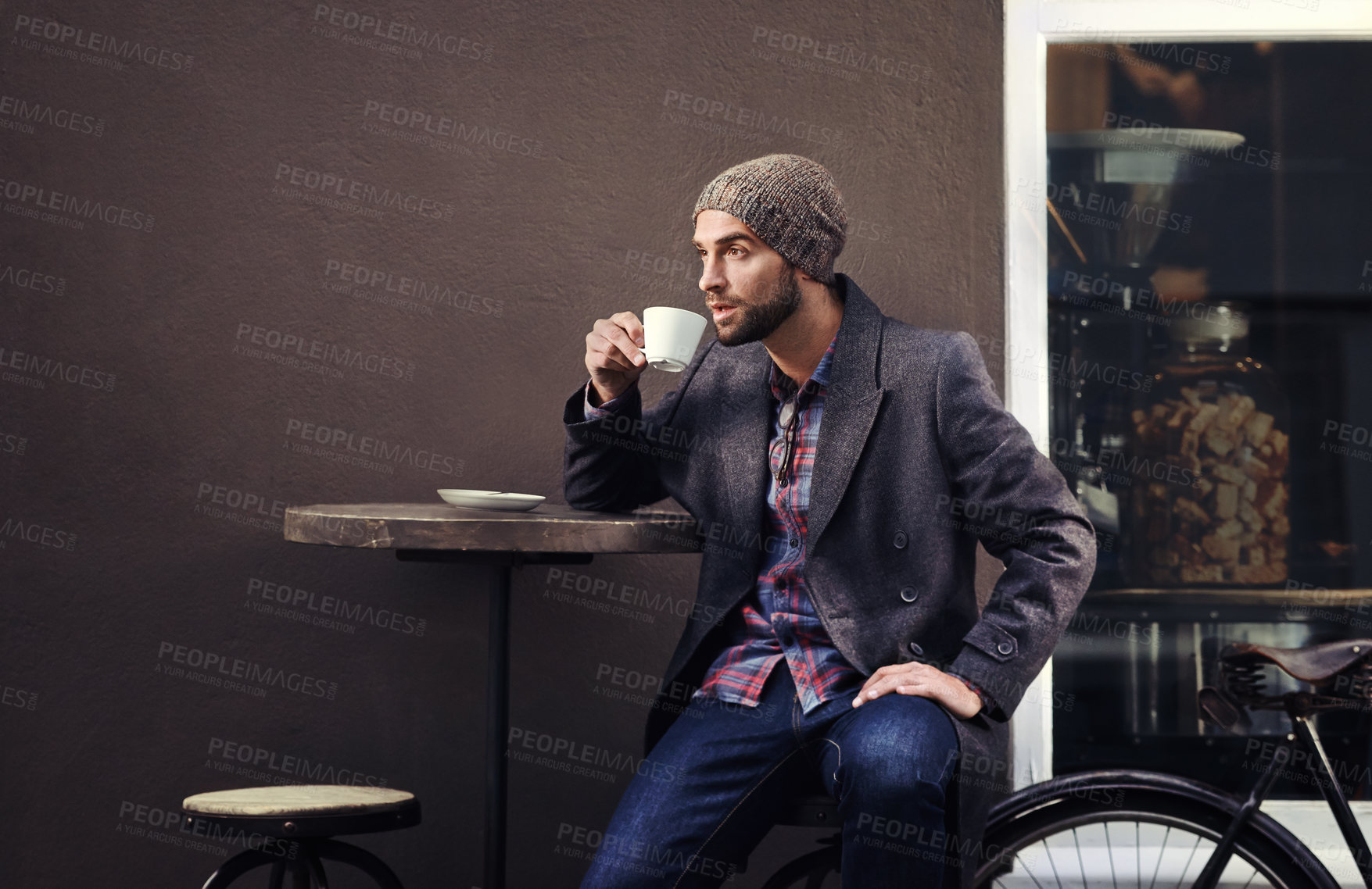 Buy stock photo Thinking, shop and man drinking coffee in city at table for breakfast with mockup space in the morning. Dream, tea cup and serious person with espresso, latte or planning future at cafe with bicycle