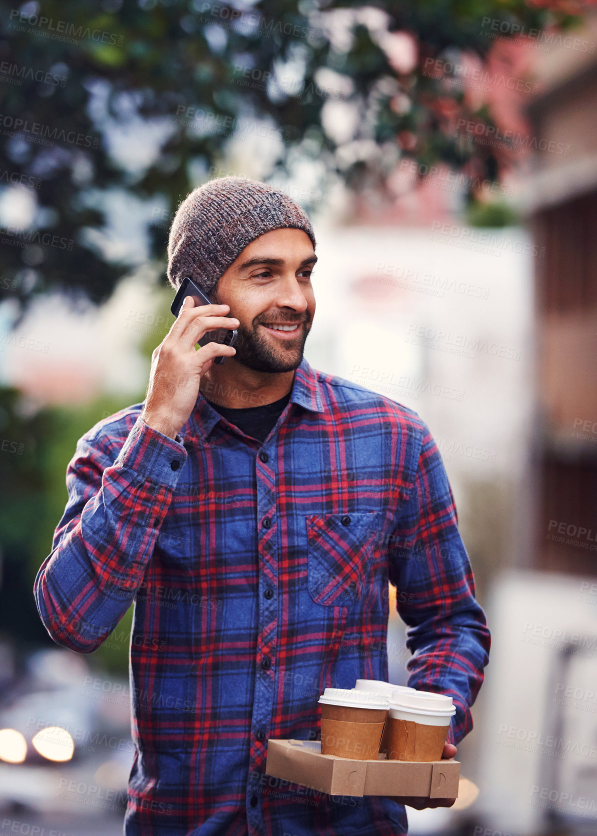 Buy stock photo Phone call, coffee and walking for male person, smile and take away drinks for friends. Happy, conversation and communication on smartphone, tea and colleagues in city or urban area for relaxed man