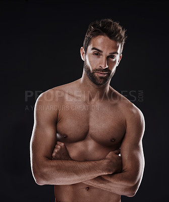 Buy stock photo Portrait, muscle and body of confident man in studio isolated on a black background for wellness, sexy or six pack. Model, face and topless person with arms crossed for health and strong abs in Spain