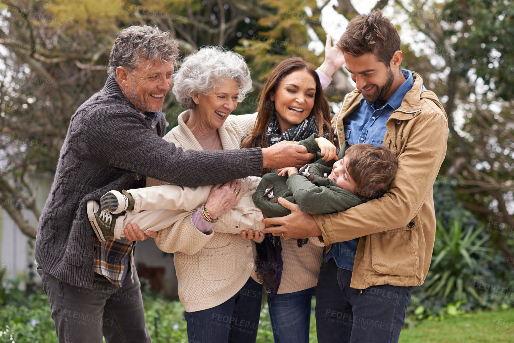 Buy stock photo Happy family, child and grandparents playing with parents in a park on outdoor vacation, holiday and excited together. Backyard, happiness and people play with kid as love, care and bonding in nature