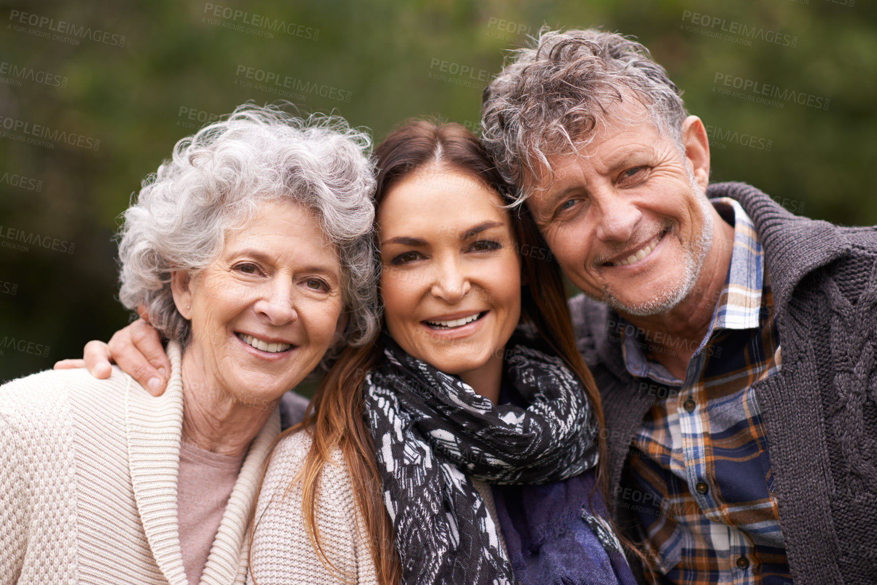 Buy stock photo Portrait, outdoor and senior parents with adult daughter, embrace and happy with nature and bonding together. Face, family or group with fresh air and hug with smile and old mother with mature father