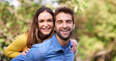 Buy stock photo Portrait of a happy young couple spending time together outside