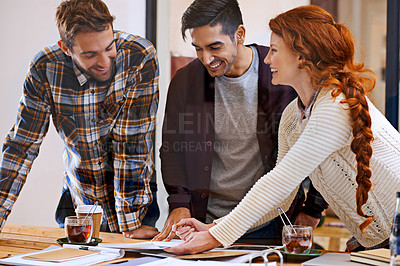 Buy stock photo Shot of a team of young designers working together in their office