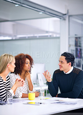 Buy stock photo A group of colleagues discussing business matters
