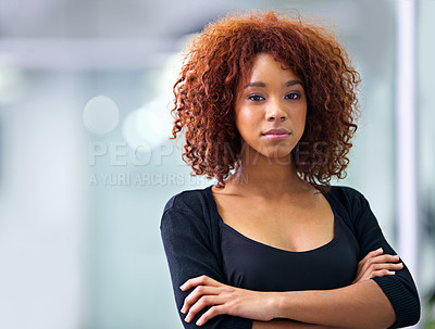 Buy stock photo Portrait of a young African American businesswoman smiling confidently at the camera