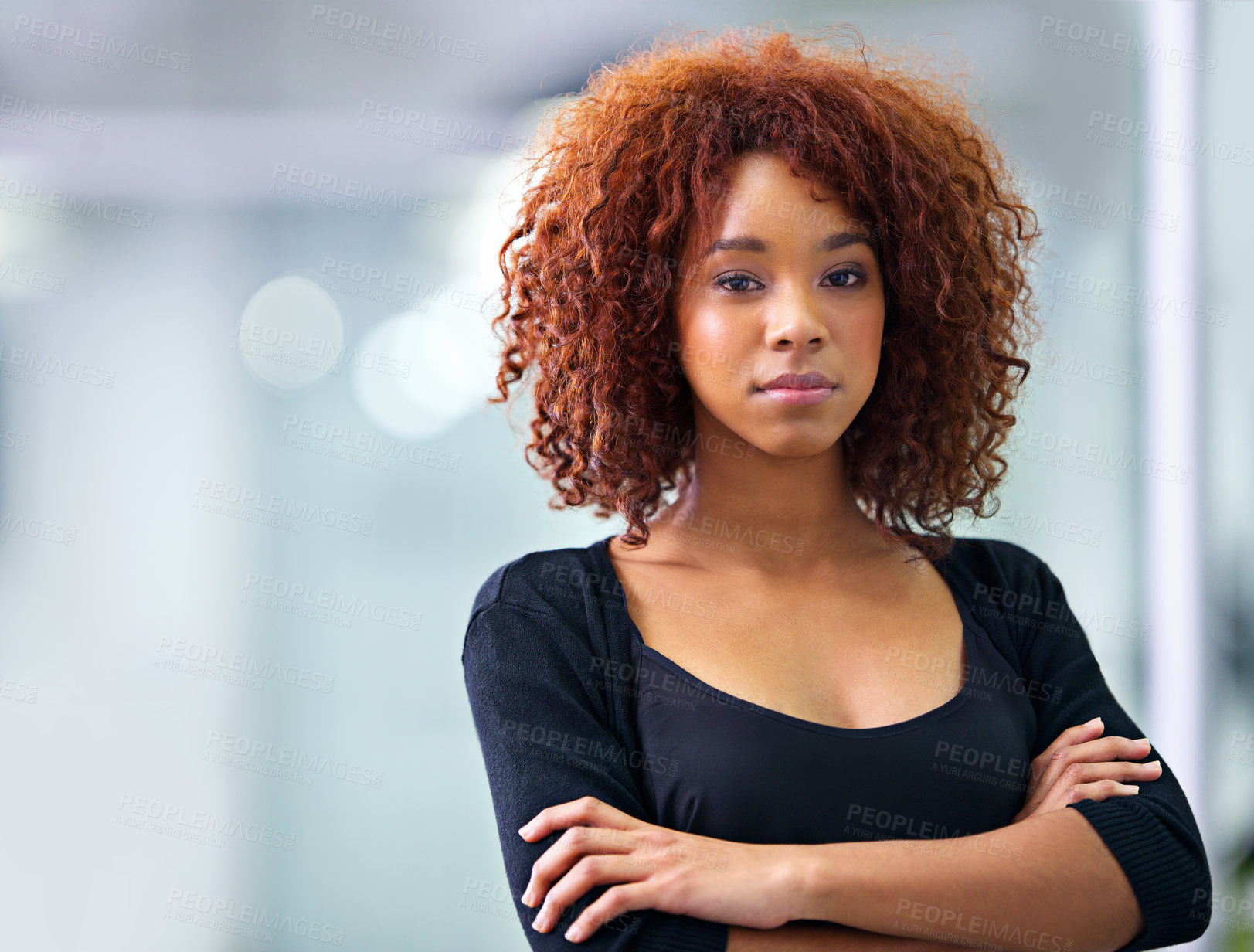 Buy stock photo Portrait of a young African American businesswoman smiling confidently at the camera