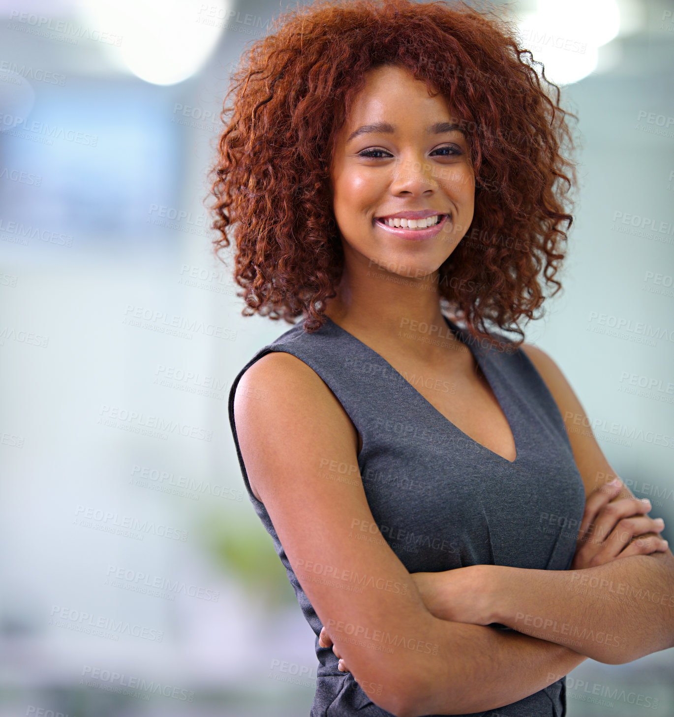 Buy stock photo Portrait of a young African American businesswoman smiling confidently at the camera