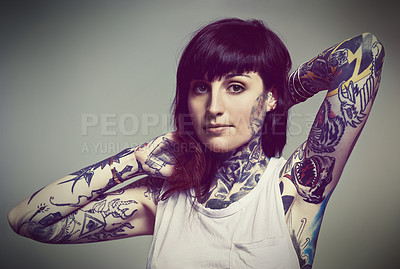 Buy stock photo Portrait, tattoo or edgy woman in tank top on grey background for gothic style isolated in studio. Rockstar, unique or female punk model with ink on skin for body art, fashion or creative expression