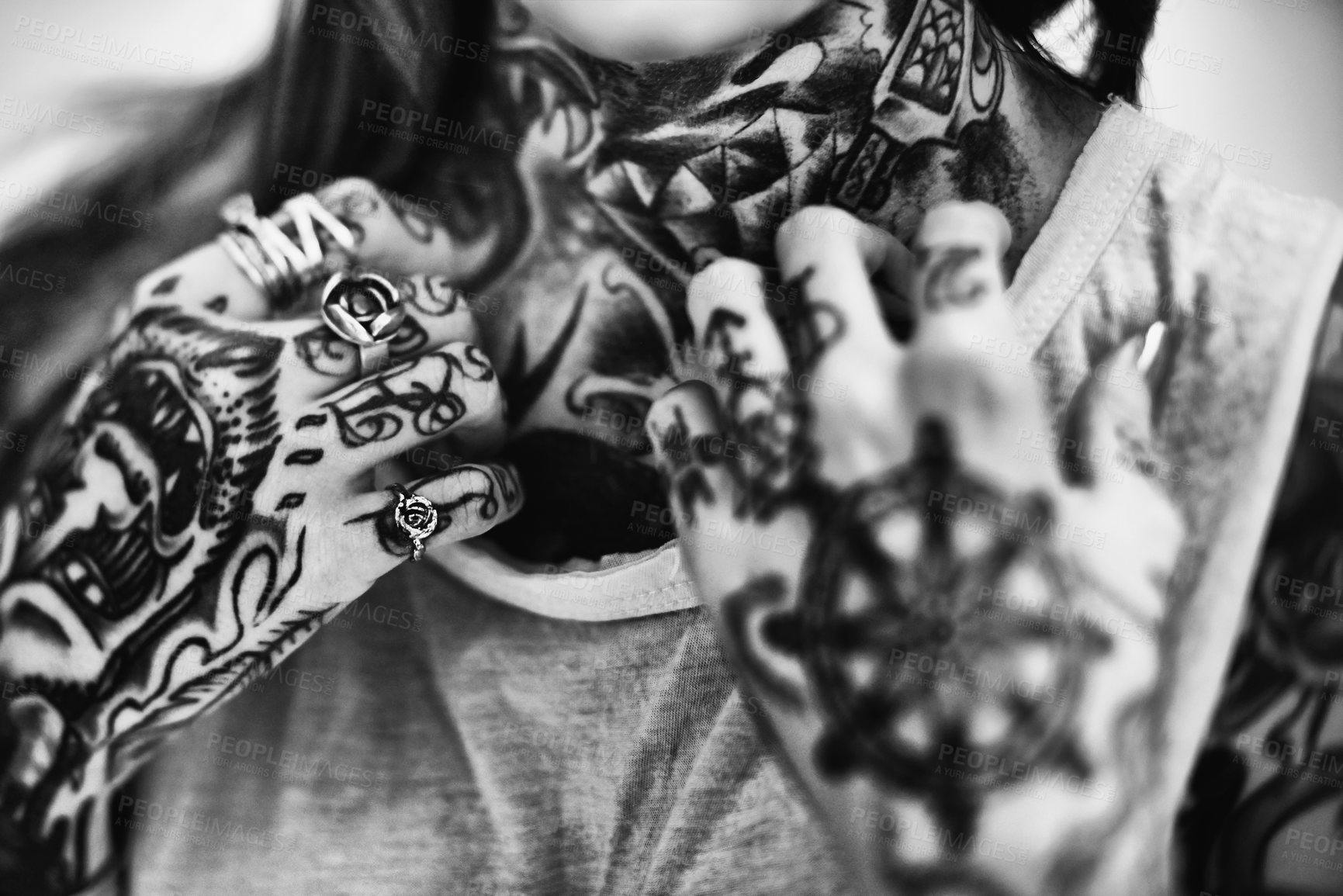 Buy stock photo A cropped studio portrait of a tattooed young woman