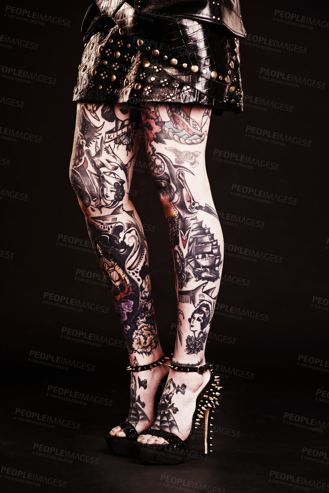 Buy stock photo Studio shot of a woman's tattooed legs