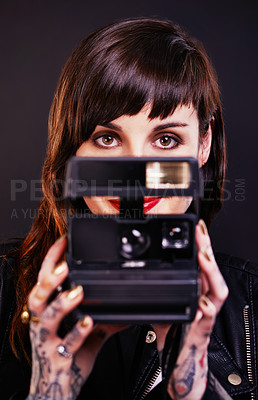 Buy stock photo Photography, portrait and woman with vintage camera in studio for hobby, creative job or memory. Smile, digital technology and photographer with satisfaction, tattoo and device on black background