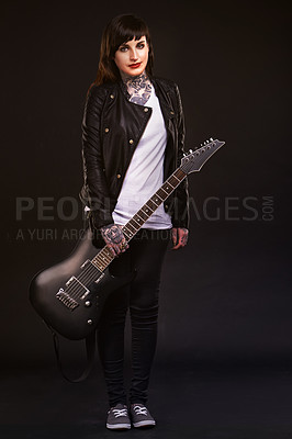Buy stock photo Portrait, guitar and woman with punk rock, instrument and musician on dark studio background. Person, artist and model with edgy clothes and fashion with creative and culture with rebel and tradition