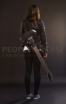 Buy stock photo Woman, guitar and fashion for musical instrument, sound and trendy for retro and style on dark background. Young person or musician for creative, funky and edgy for bold with leather jacket for rock