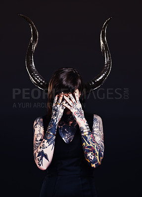 Buy stock photo Studio shot of a tattooed young woman