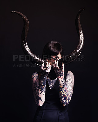 Buy stock photo Horns, demon and woman with tattoo in portrait for dark magic, horror or artistic aesthetic in studio. Creative nightmare, halloween culture and unique person with scary bones on black background