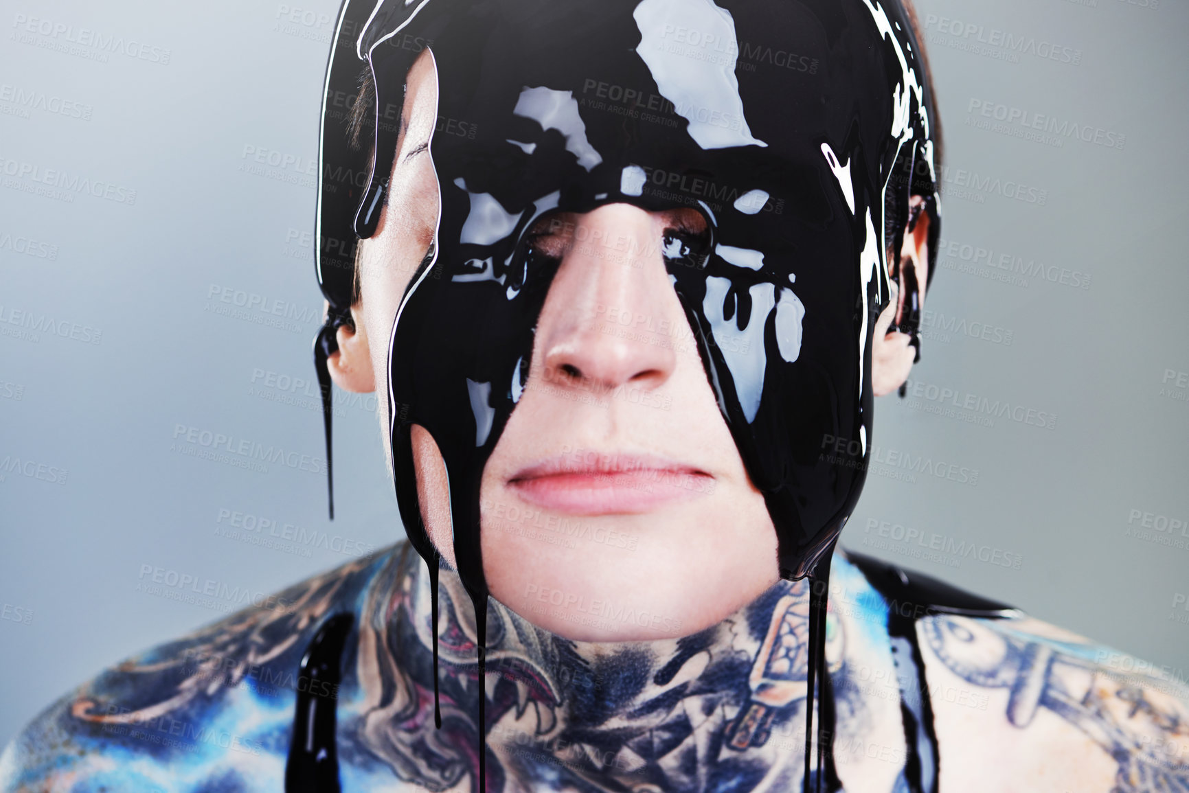 Buy stock photo Abstract, paint and face with black ink for rock, tattoo and punk art in creative career isolated on gray background. Person, liquid and closeup for surreal, unique and grunge on studio backdrop