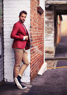 Buy stock photo Man, confident and fashion in urban wall or outdoor with outfit for casual or office wear for trends and style. Thinking, street and city in elegant clothes with blazer in downtown for classy look