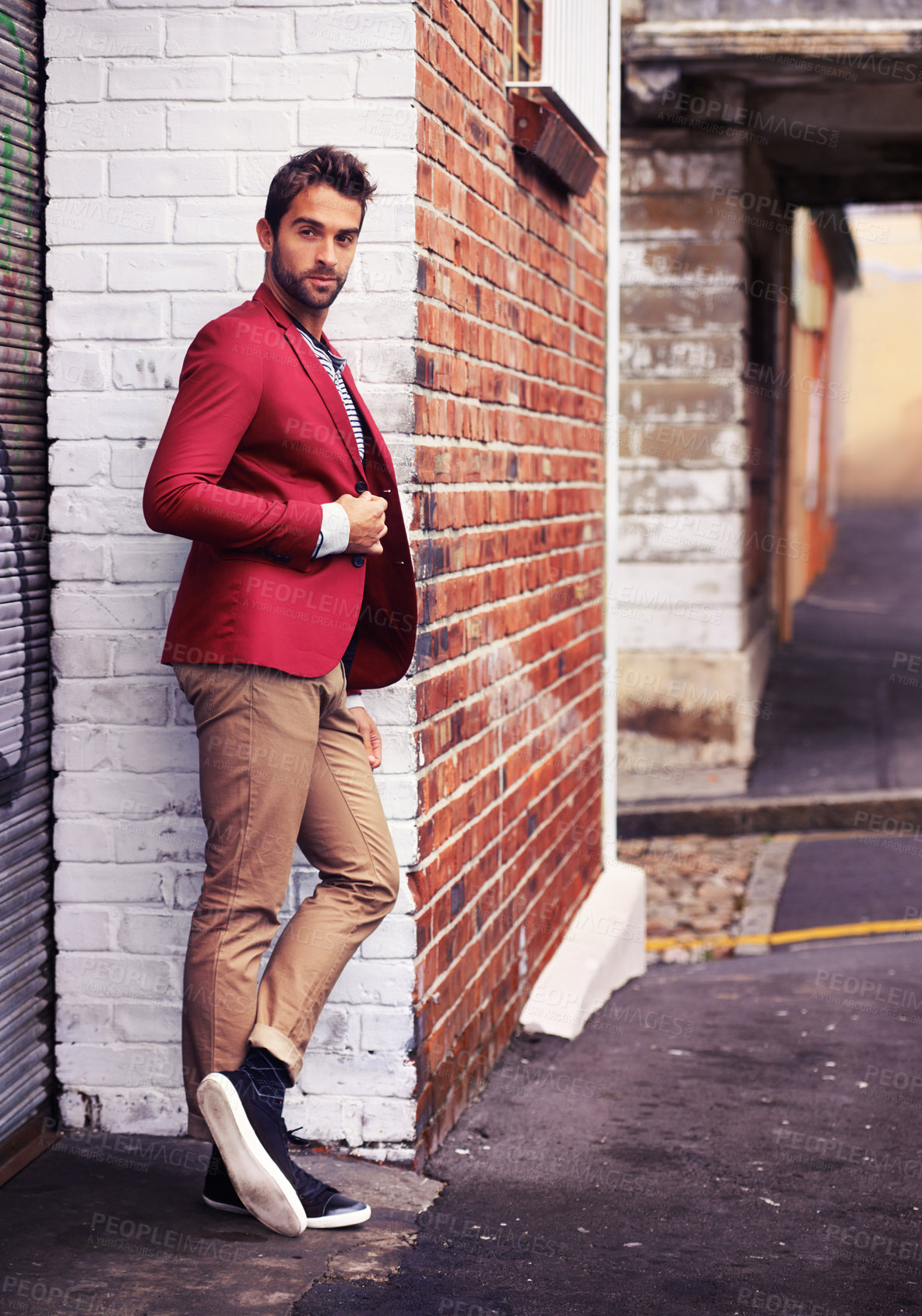 Buy stock photo Man, confident and fashion in urban wall or outdoor with outfit for casual or office wear for trends and style. Thinking, street and city in elegant clothes with blazer in downtown for classy look