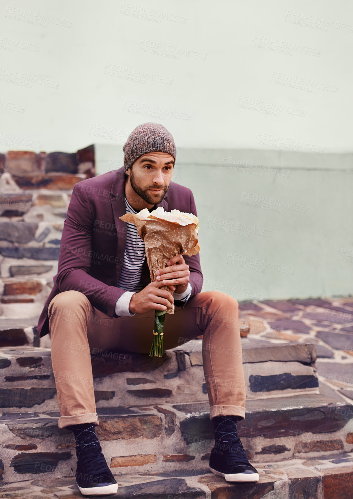 Buy stock photo Stairs, love and man with flowers for anniversary, valentines day or first date in outdoor city. Roses, bouquet and male person on steps for romantic gift, celebration and waiting in urban town