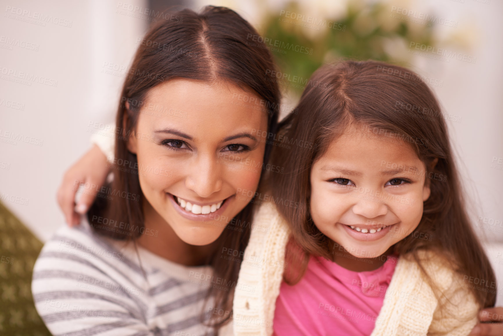 Buy stock photo Portrait, woman and daughter with smile for hug in home with love, care and happiness in living room. Apartment, mother and girl in lounge to relax on sofa or couch for bonding in family house