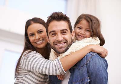 Buy stock photo Mom, dad and girl in home for portrait with love or care, quality time and family bonding for memories or connection. Parents, child and together for comfort or safety on weekend, hug and happiness.