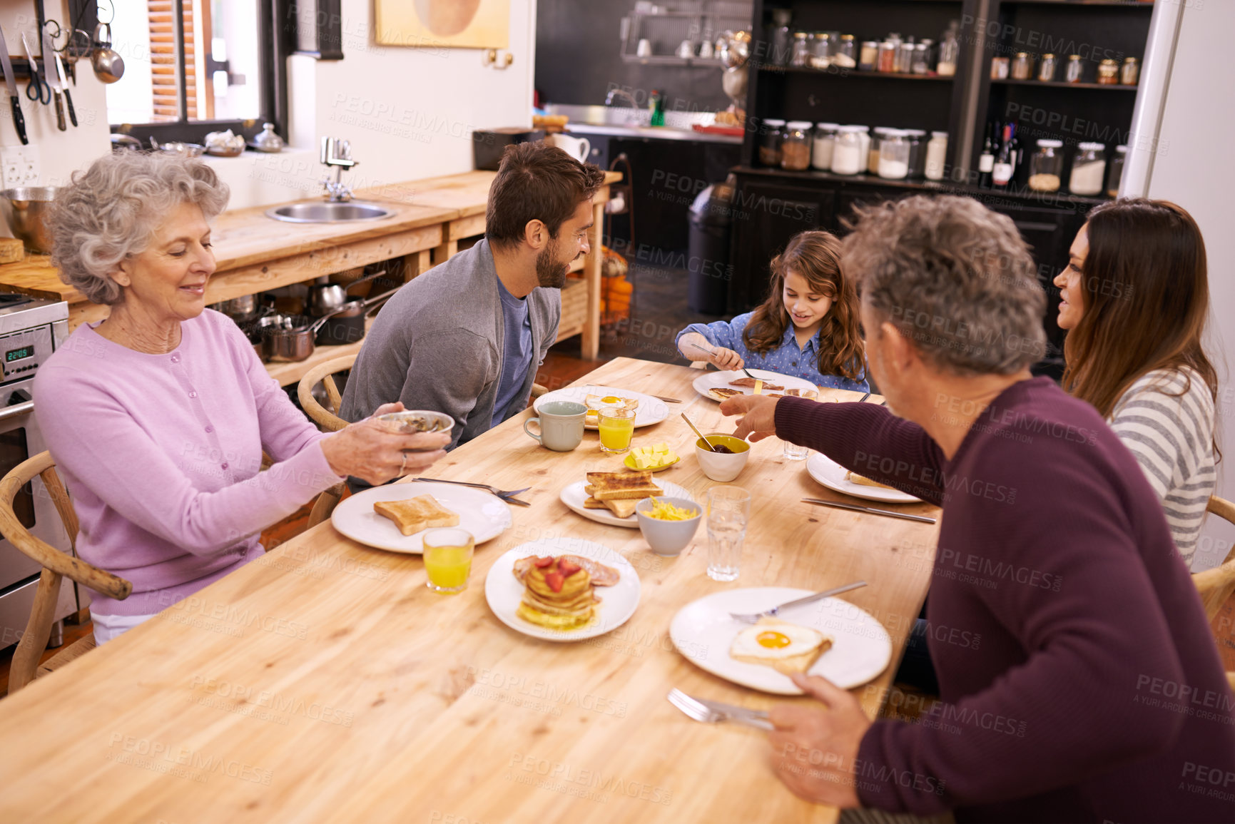 Buy stock photo Breakfast, family home celebration and grandparents with kitchen table and smile with love and weekend break. Parents, food and senior people eating meal together with conversation, joy and nutrition