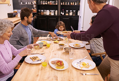 Buy stock photo Family, breakfast and kitchen table for morning and food with juice and hungry for eat. Senior person, mother and father with child for brunch in house for weekend, relax and bonding with meal   
