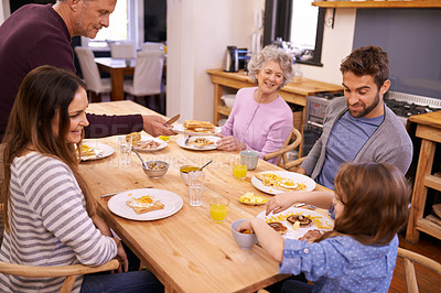 Buy stock photo Love, breakfast and big family in a kitchen with pancakes, eating or bonding at a table together. Food, diet and kid with people in a house with waffle for brunch, nutrition or communication at home