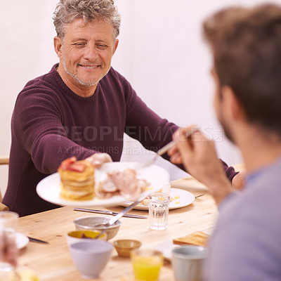 Buy stock photo Breakfast, mature and man with food on dining table for eating with smile for healthy meal and diet. Adult, male person and father to son with visit for Easter holiday in home  for communication