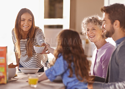 Buy stock photo Cropped shot of a family having breakfast together