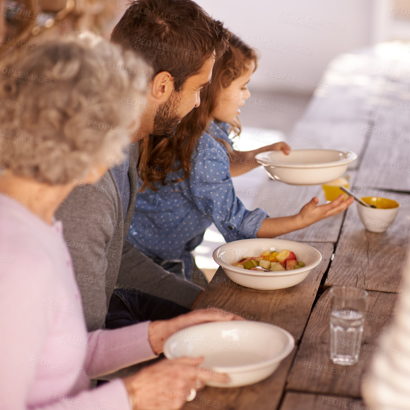 Buy stock photo Family, father and daughter at breakfast with food for nutrition, bonding and eating together with grandma. People, healthy diet and relax at dining table in the morning for wellness and meal in home