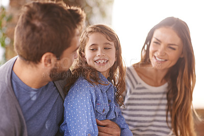 Buy stock photo Happy family, smile and love outdoor hugging for summer, sunshine and vacation. Father, mother and daughter in morning for bonding, together and holiday with connection, embrace and relationship.