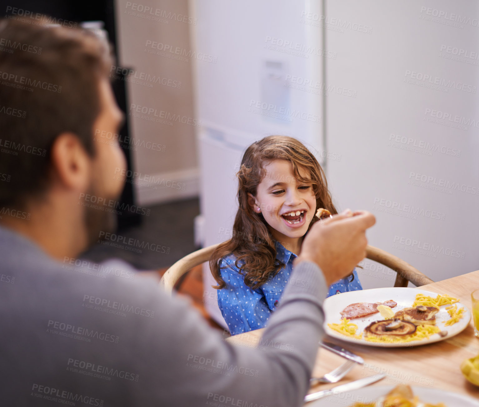 Buy stock photo Dad, child and laugh in morning with breakfast for routine with family time, happiness and nutrition. Father, girl and together for bonding with food, feeding and homemade with love for healthy diet