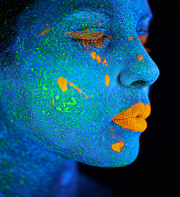 Buy stock photo Woman, abstract and psychedelic paint for makeup with creativity, glow skin and fantasy beauty in studio. Girl, neon lips and cosmetics for portrait by black background, unique art and blue face 