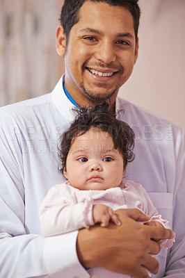 Buy stock photo Portrait, home and father with baby, smile and tradition with happiness, cheerful and bonding together. Face, Islamic family or dad with infant or embrace with joy or love with hug or eid celebration