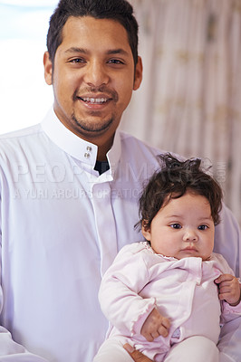 Buy stock photo Muslim, family and portrait of dad with baby in home for bonding, relationship and calm together. Parenting, happy and Islamic father with newborn infant for love, childcare or support in living room