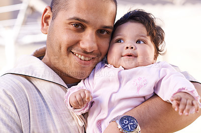 Buy stock photo Love, muslim father and baby in portrait for bonding, relationship and smile together. Islam, happy family and dad with newborn infant for childcare, affection and support with happiness or joy