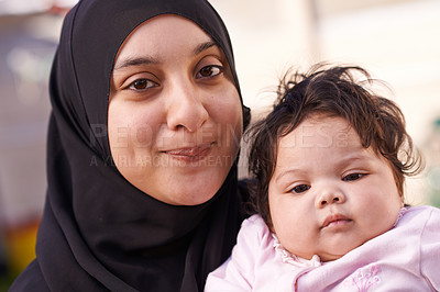 Buy stock photo Muslim, family and portrait of mother with baby in home for bonding, smile and calm together. Parenting, happy and Islamic mom with newborn infant for love, childcare or support in living room