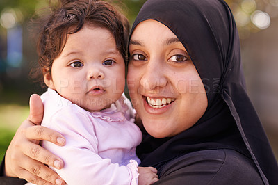 Buy stock photo Muslim woman, mother and baby in portrait for love, care and bonding during Eid in Cape Town, South Africa. Female person, child and family together outdoor in nature, garden and backyard with smile