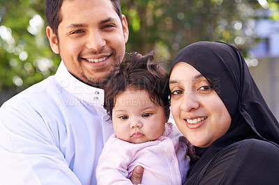 Buy stock photo Muslim, family and portrait of parents with baby in park for bonding, Ramadan and outdoors together. Islam, happy and mother, father and newborn infant for love, childcare or support in garden