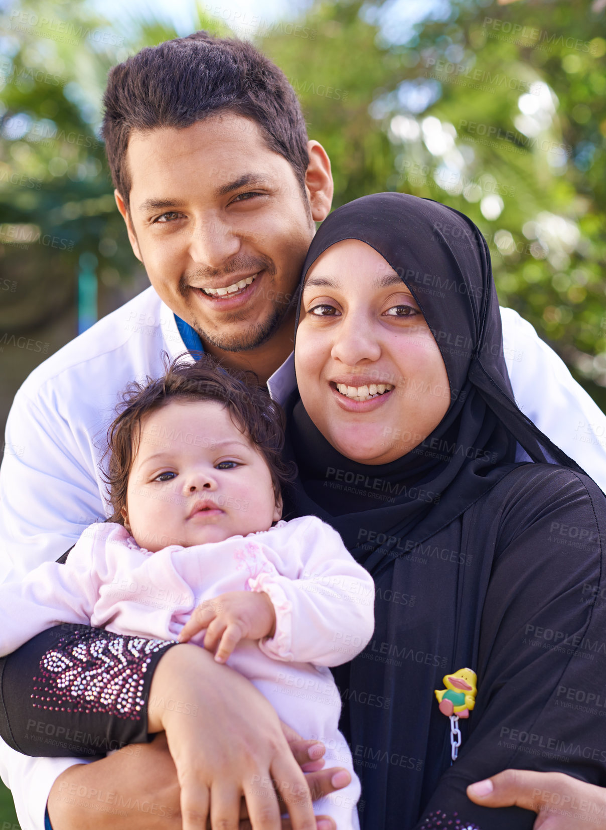 Buy stock photo Muslim, park and portrait of parents with child for bonding, ramadan and outdoors together. Islam, happy family and mother, father and newborn infant for love, childcare and support in nature