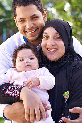 Buy stock photo Muslim, park and portrait of parents with baby for bonding, ramadan and outdoors together. Islam, happy family and mother, father and newborn infant for love, childcare and support in garden