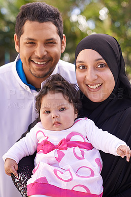 Buy stock photo Portrait of mother, father and baby in park for bonding, relationship and outdoors together. Muslim family, nature and happy parents with newborn infant for love, childcare and support in garden