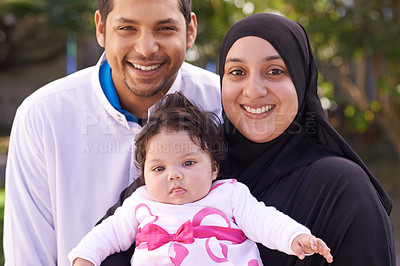 Buy stock photo Muslim family, garden and portrait of parents with baby for bonding, relationship and outdoors together. Islam, happy and mother, father and newborn infant for love, childcare or support in park