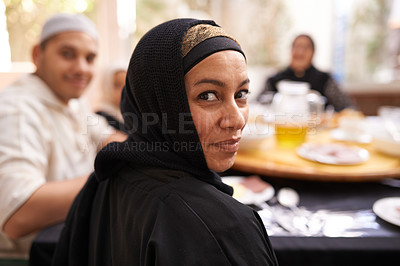 Buy stock photo Muslim woman, portrait and family in house with dinner, celebration and Ramadan at dining table. Islamic people, culture and religion with food, drinks and Iftar for breaking fast at sunset 