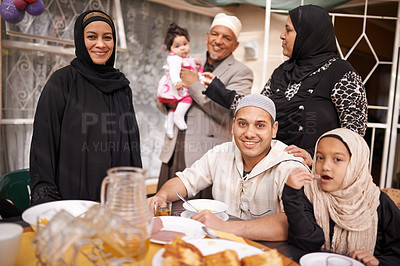 Buy stock photo Shot of a muslim family eating together